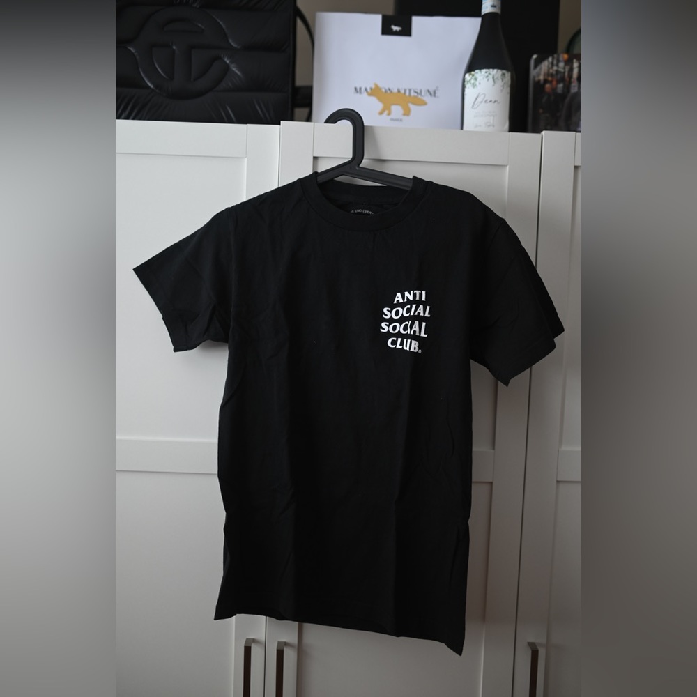 Antisocial Social Club t-shirt with cherry blossom logo.